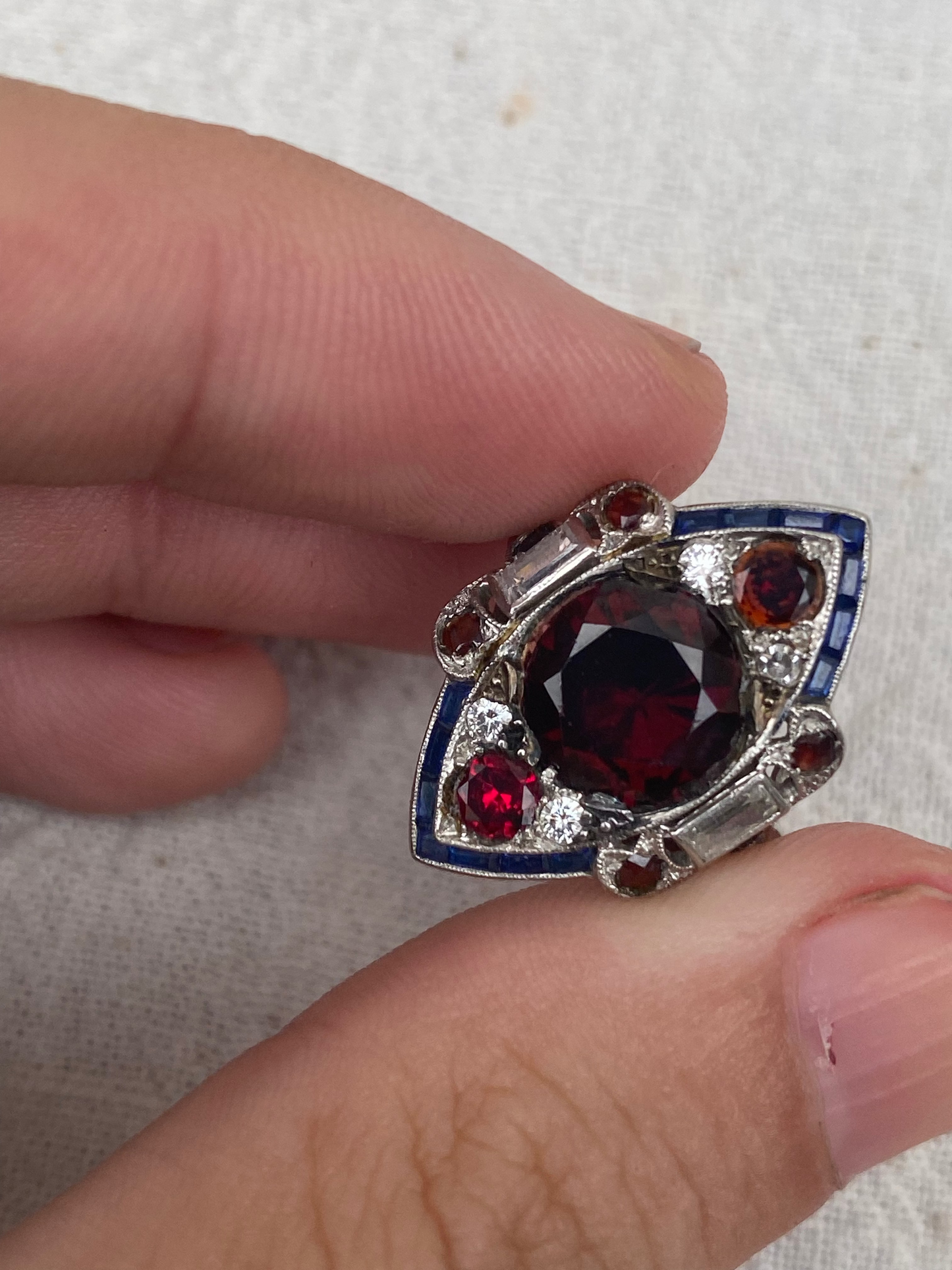 art deco platinum ring with garnet sapphire diamonds