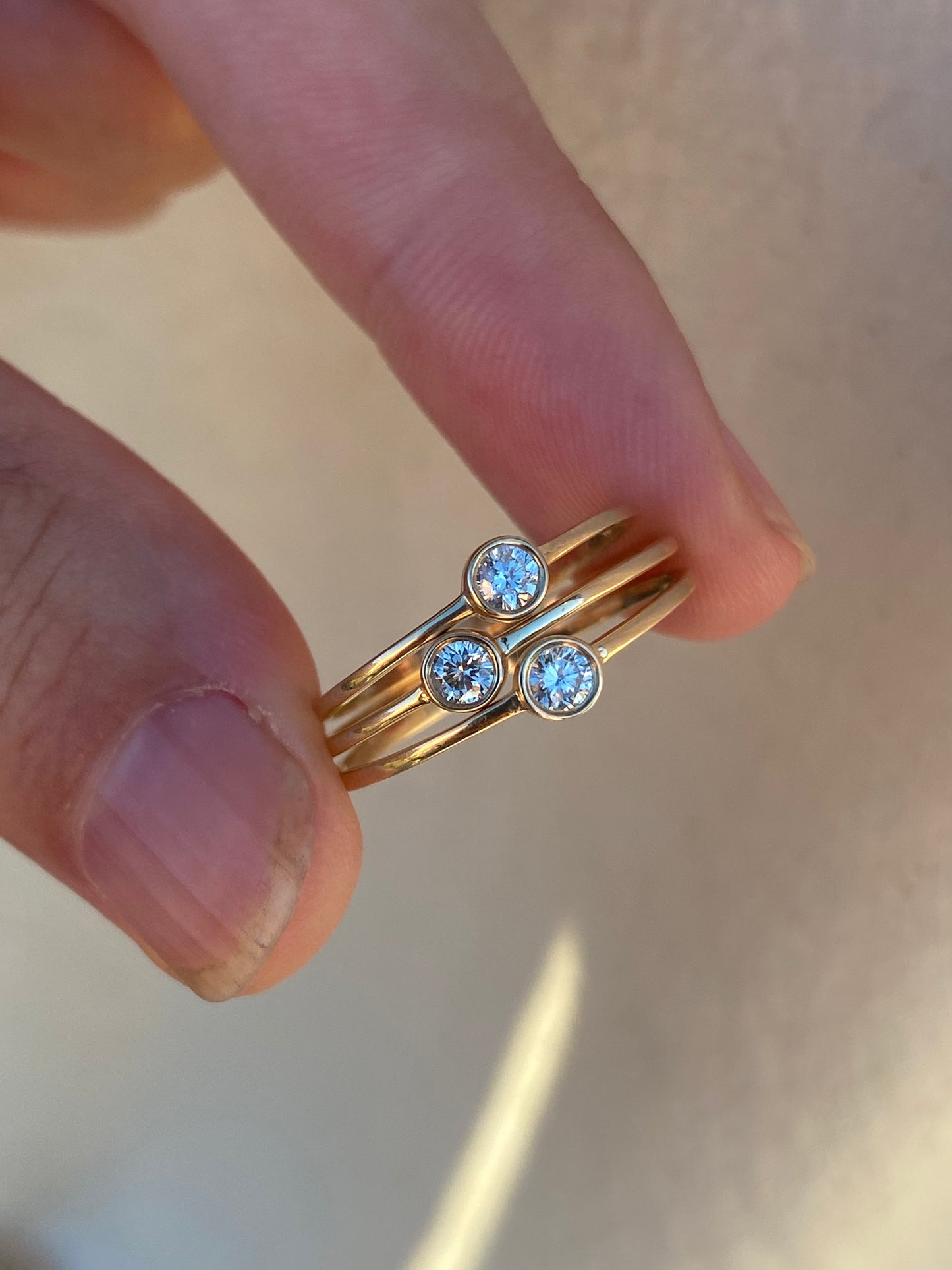 14kt .11ctw diamond bezel ring