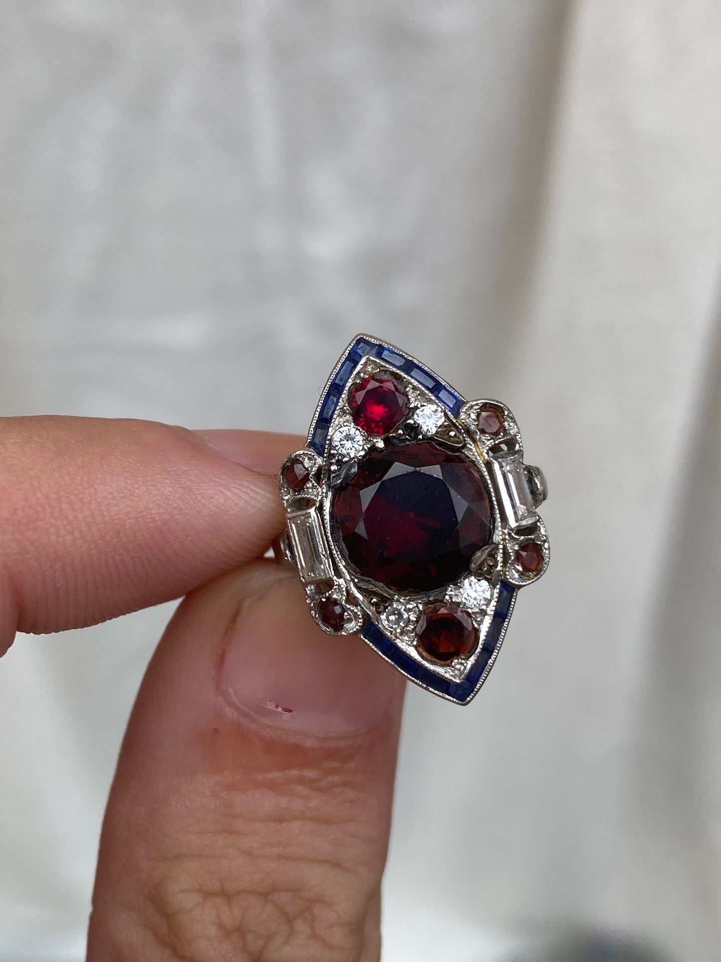 art deco platinum ring with garnet sapphire diamonds