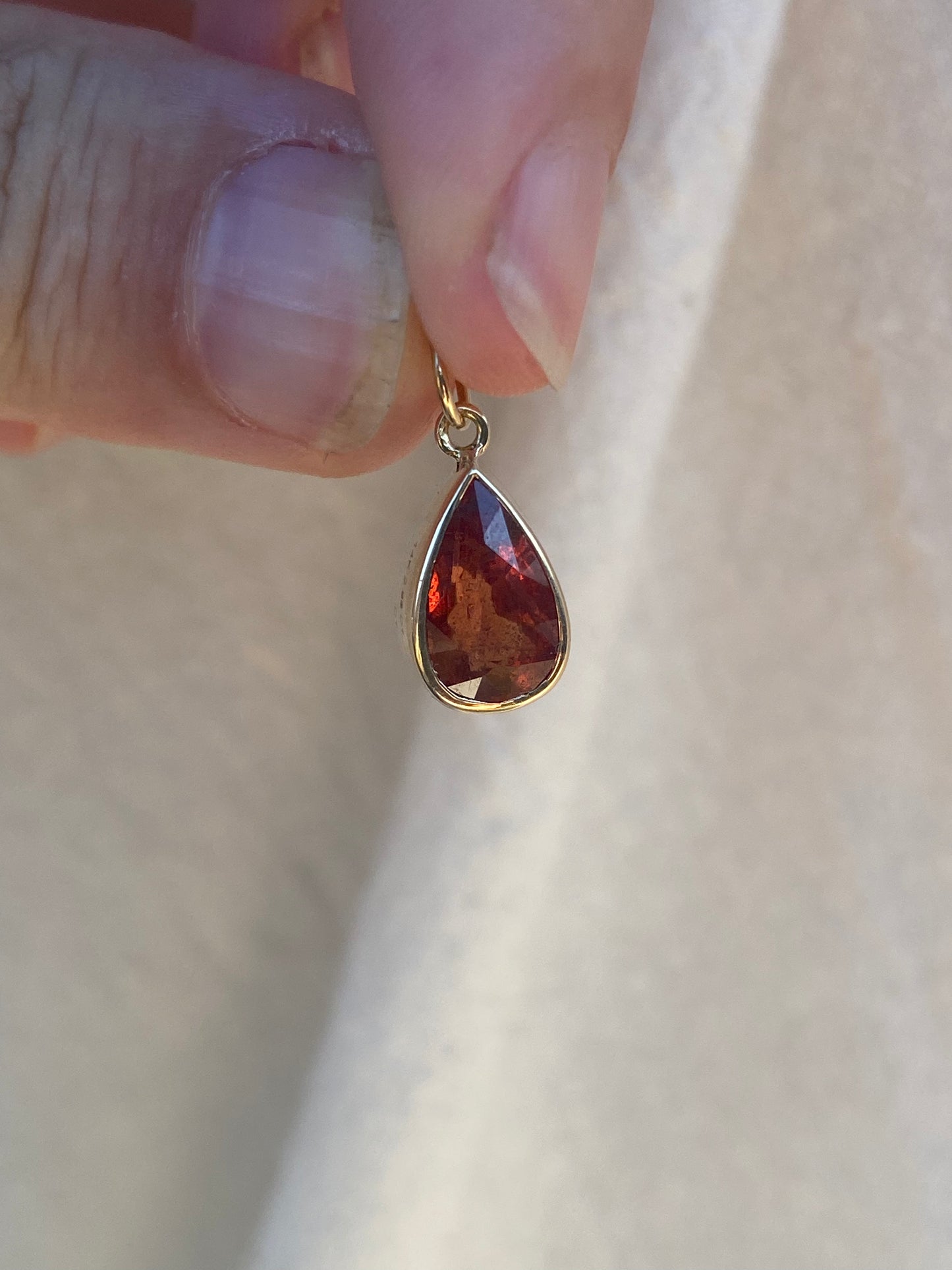 14kt 2.88ctw red/orange sapphire bezel pendant