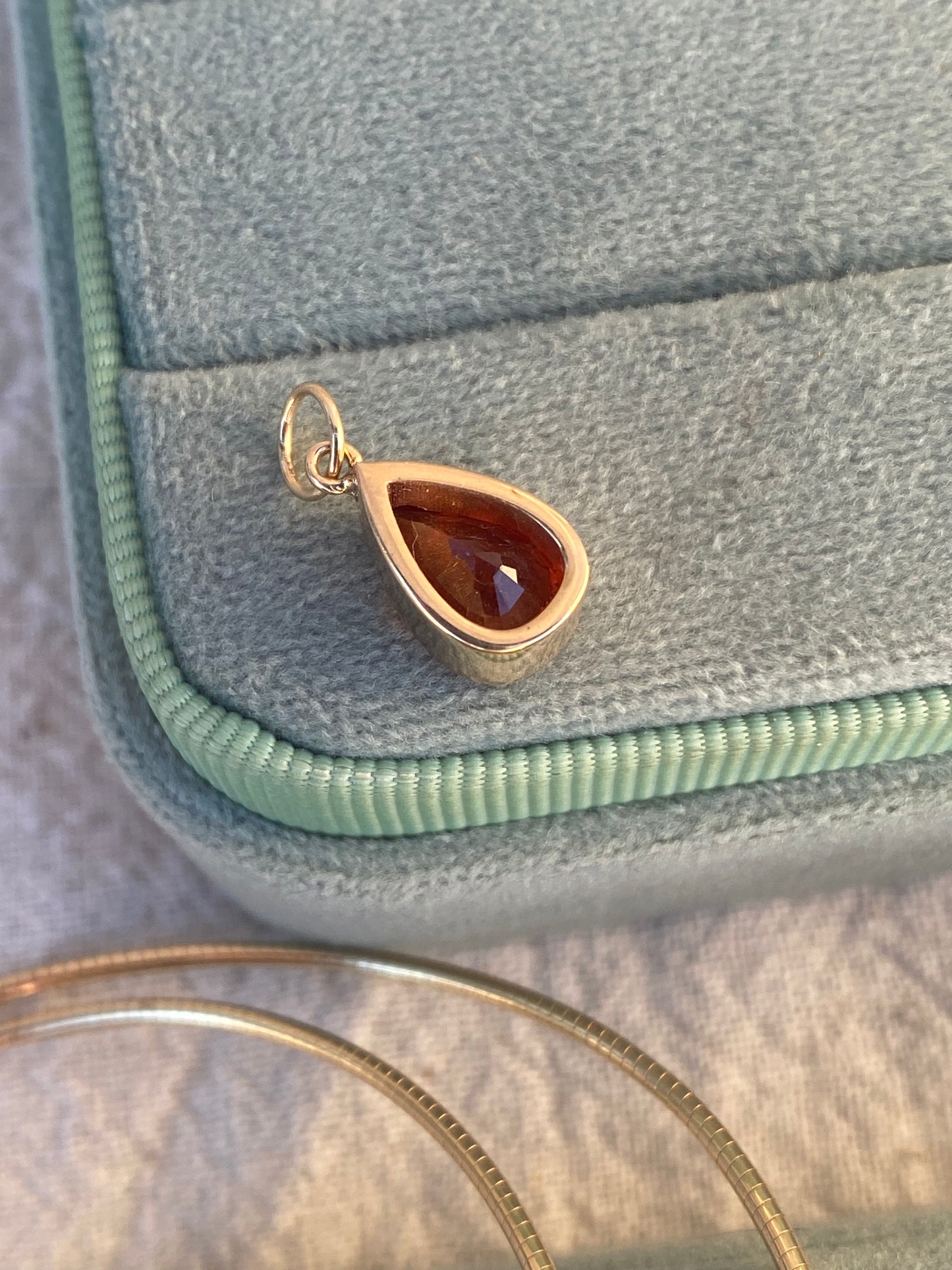 14kt 2.88ctw red/orange sapphire bezel pendant