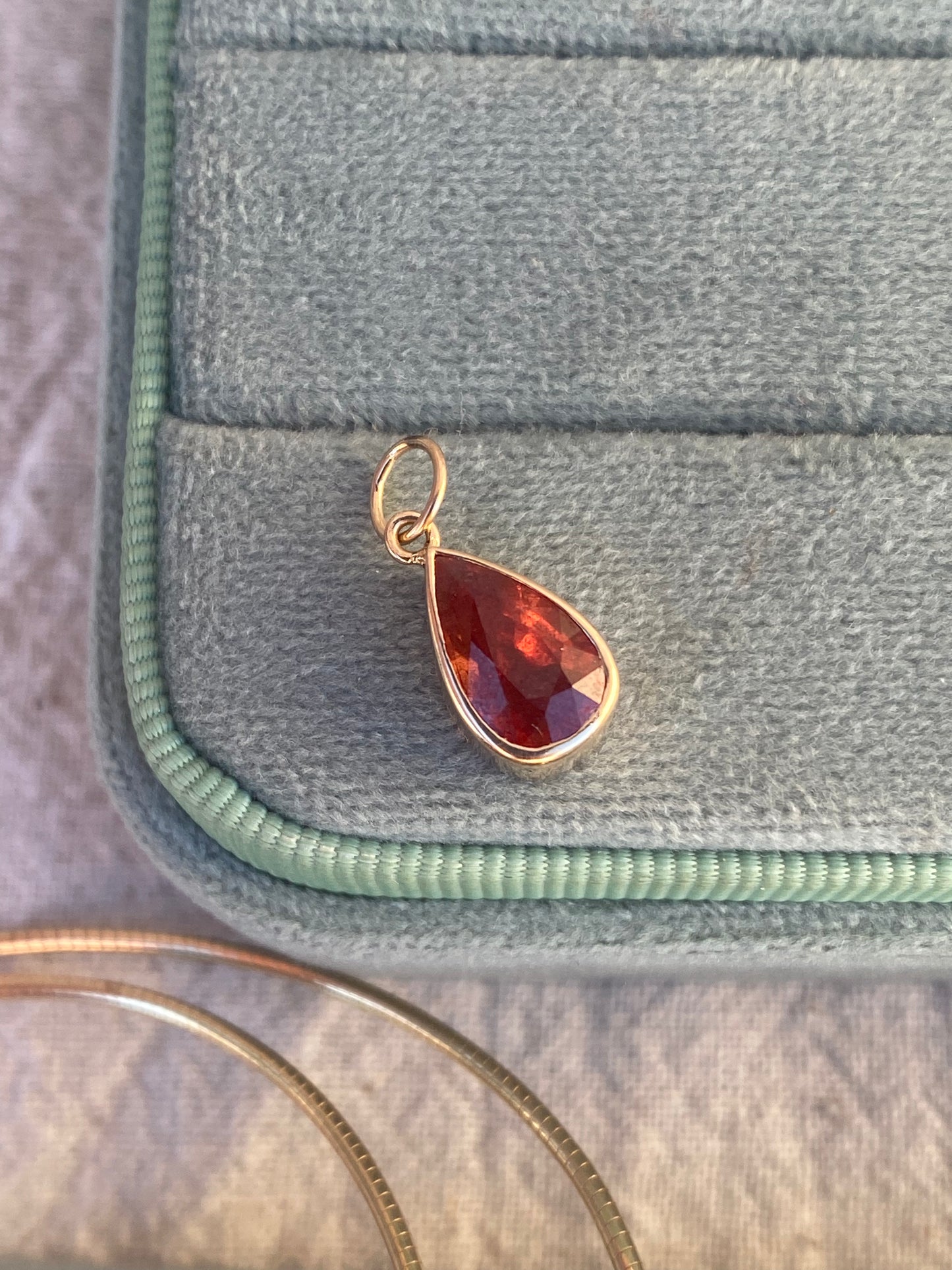 14kt 2.88ctw red/orange sapphire bezel pendant
