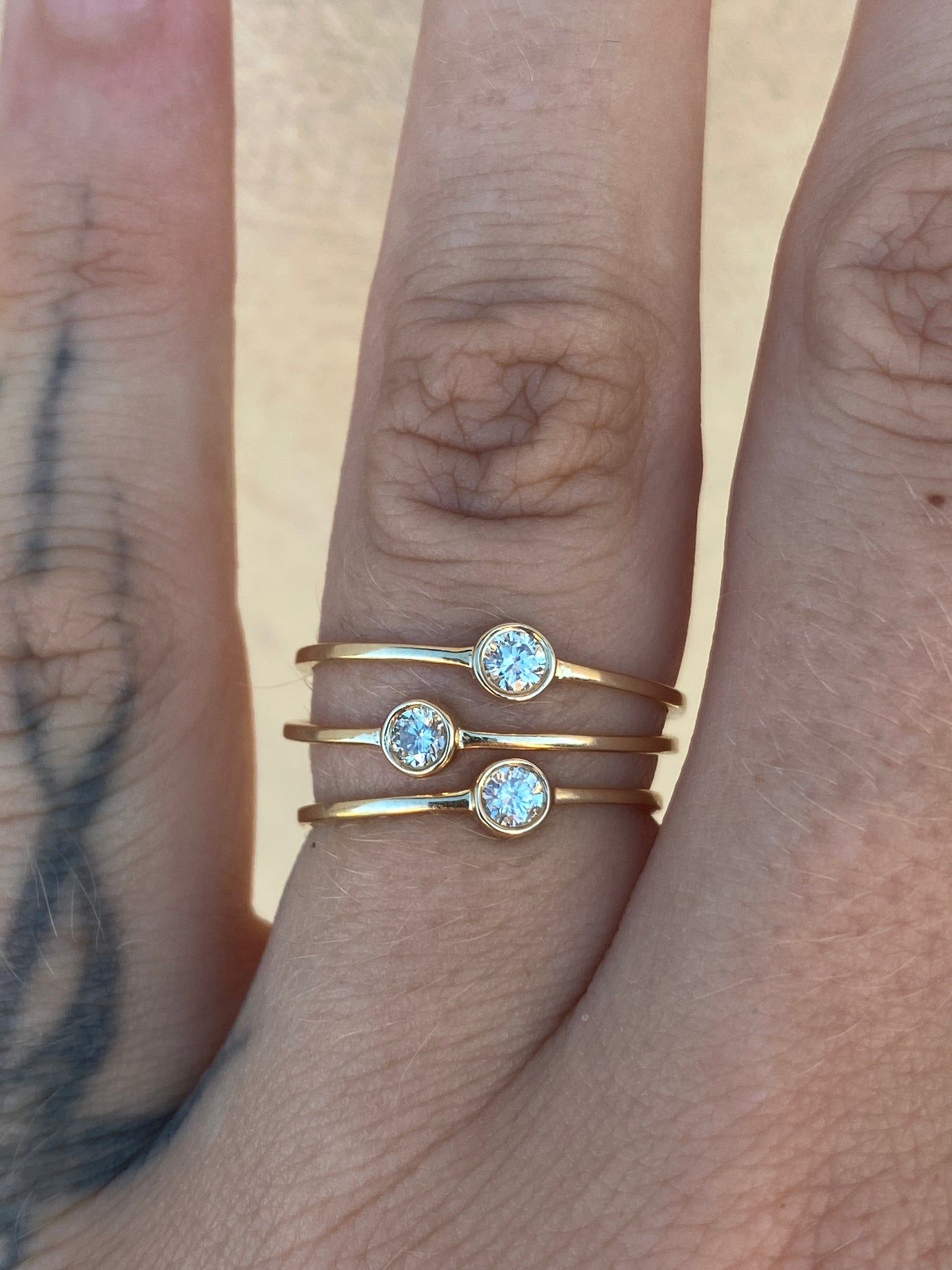 14kt .11ctw diamond bezel ring