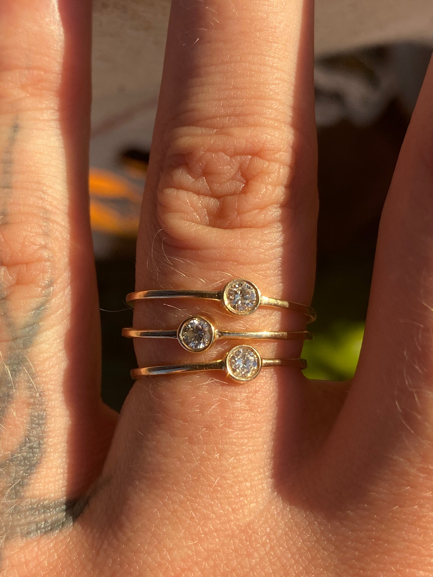 14kt .11ctw diamond bezel ring
